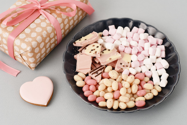 Flatlay of Gift and Different Sweets on Grey Background